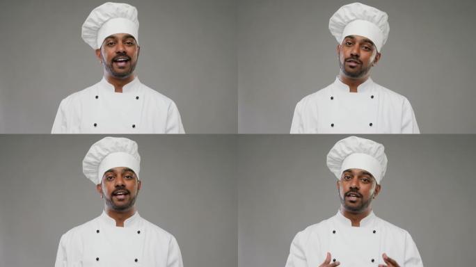 男性印度厨师在灰色背景上