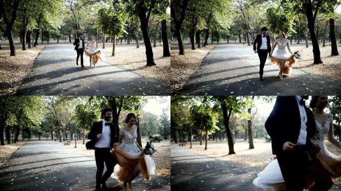在公园里奔跑的一对美丽的婚礼夫妇的慢动作