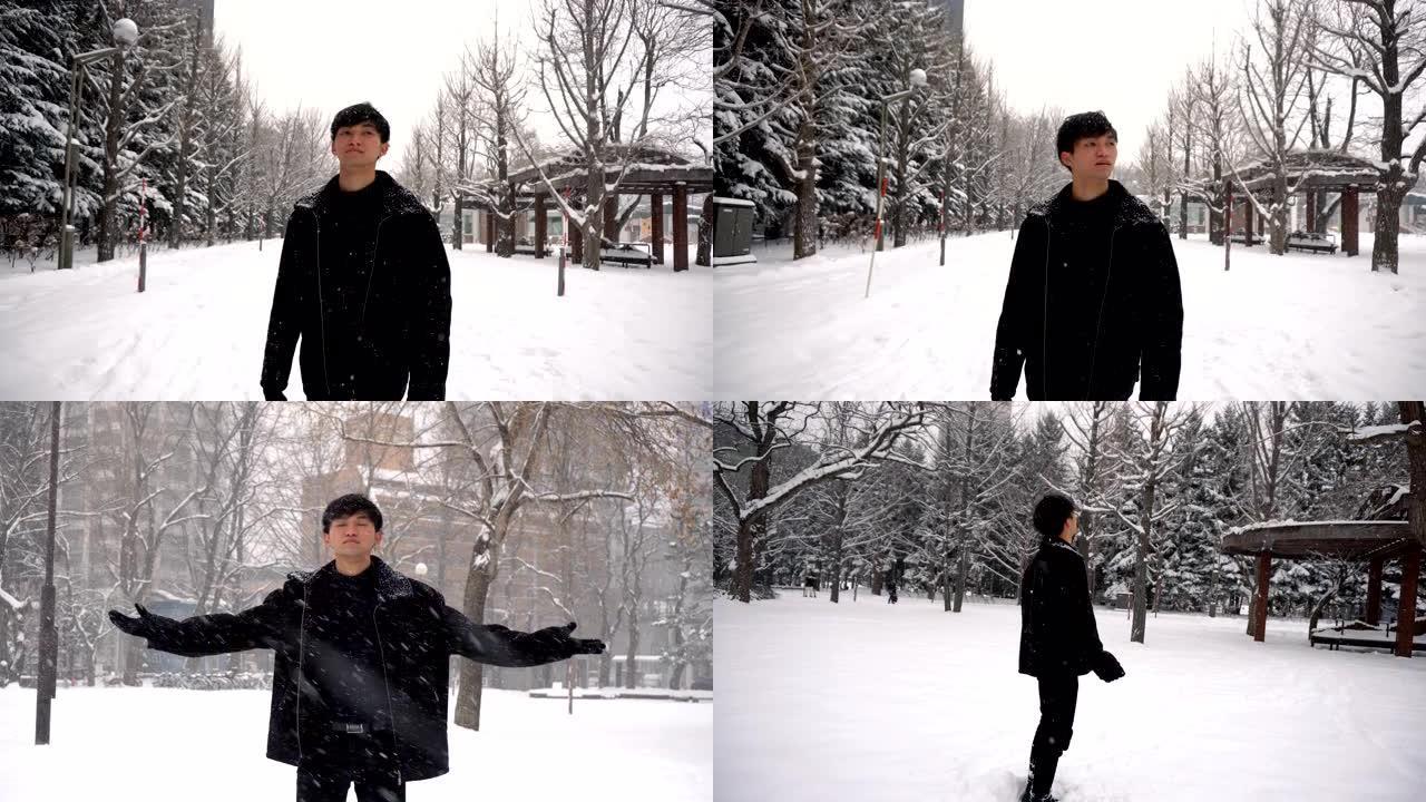 3个片段 -- 冬天下雪时快乐微笑自信的亚洲年轻人在公园