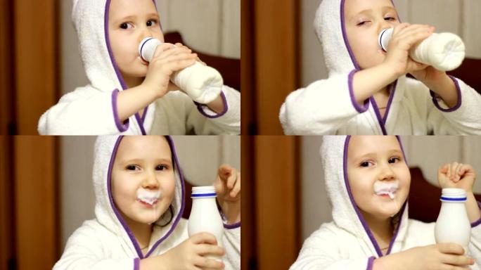 小女孩喝奶瓶、开菲尔、乳制品中的牛奶饮料。婴儿微笑着，露出酸奶中的白色胡须。