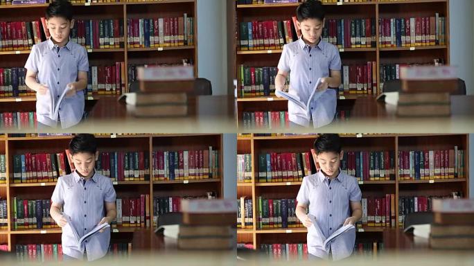 亚洲小男孩蜜蜂厌倦了阅读，泰国的图书馆