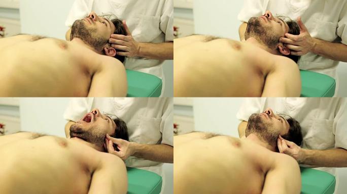 物理治疗师正在检查患者的痛点: 头部，颈部，口腔，下巴