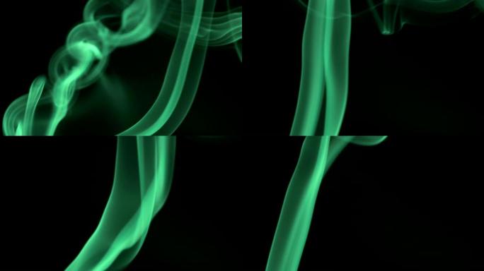 明亮的霓虹灯绿色烟雾细细的细流在黑色背景上缓慢上升。从下到上吹来的彩色烟雾。特写