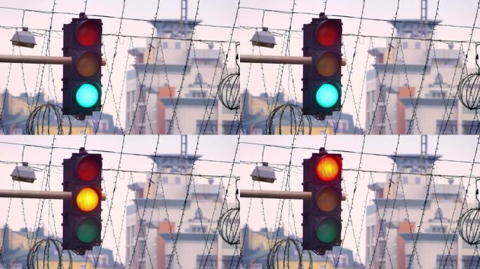 晚上城市背景上交通灯颜色从绿色变为红色的特写镜头。