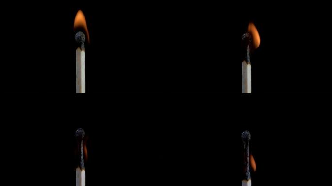 匹配自燃，燃烧并熄灭。燃烧木制火柴和火焰特写在黑色背景上壮观地燃烧着火，直到最后留下烧焦的木头火柴。
