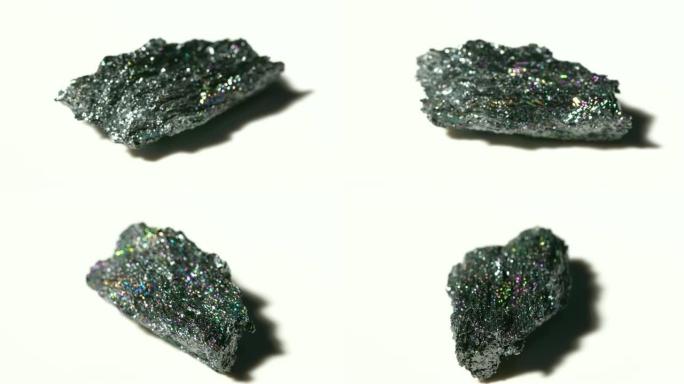白色背景旋转的彩色矿石矿物石材样品