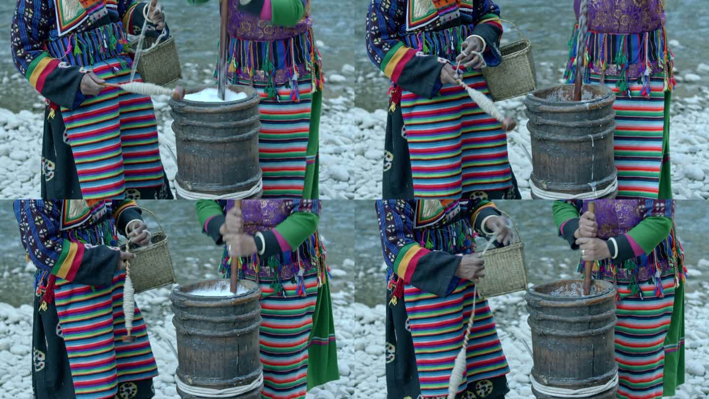 藏族妇女纺线打酥油茶