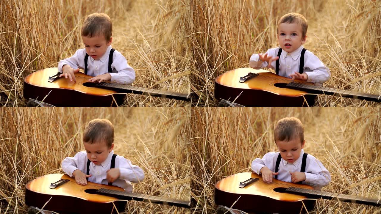 小男孩坐在金色的麦田里弹吉他
