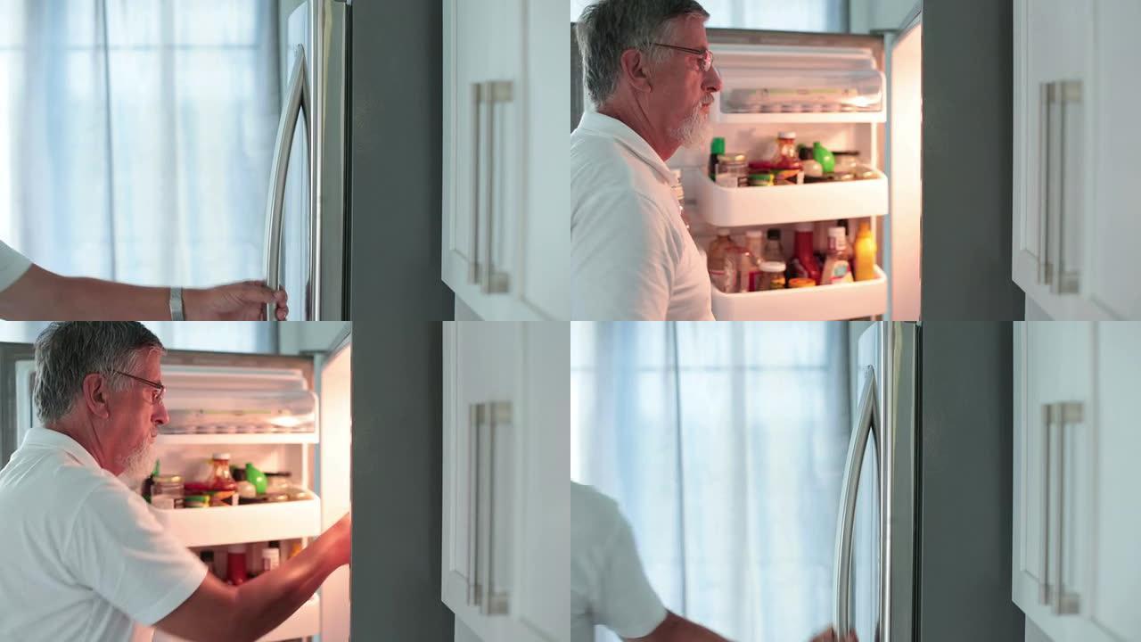 高级汉索姆男子打开冰箱