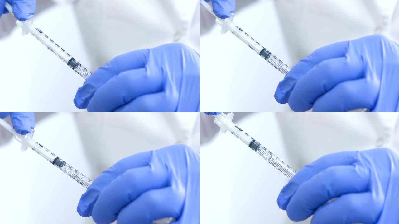 注射器在医生手里。为注射剂准备，在注射器中设置一套疫苗。
