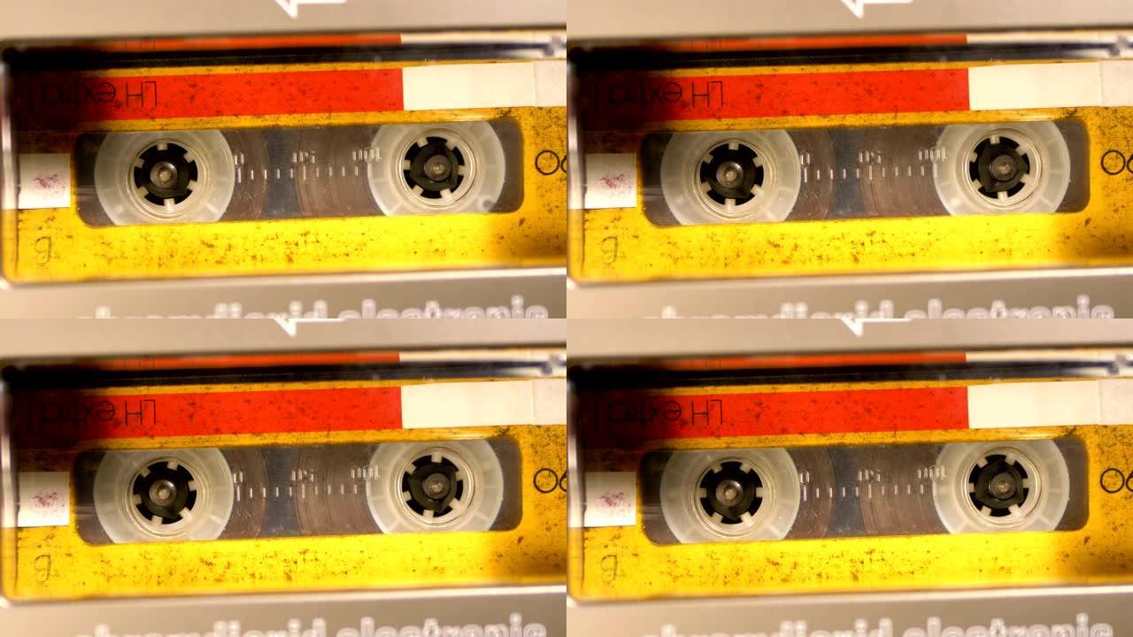老式黄色录音带在录音机中播放和旋转
