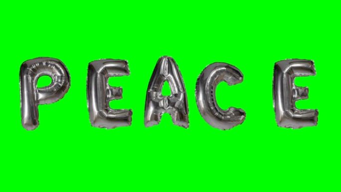 漂浮在绿色屏幕上的氦气银气球字母中的单词和平