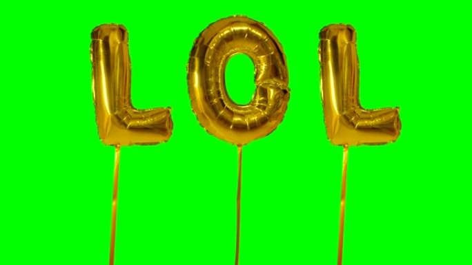 绿色屏幕上漂浮的氦气金色气球字母中的lol单词