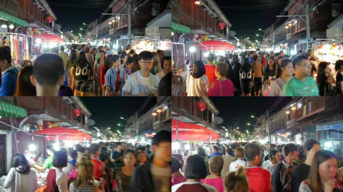 拥挤的人走在夜街市场