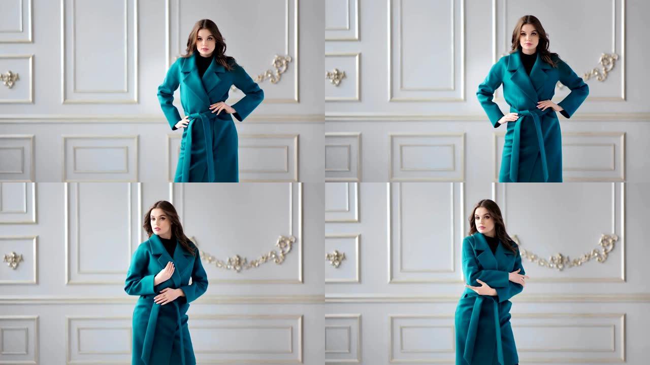 美丽的时装模特在现代豪华工作室展示时尚的秋季大衣