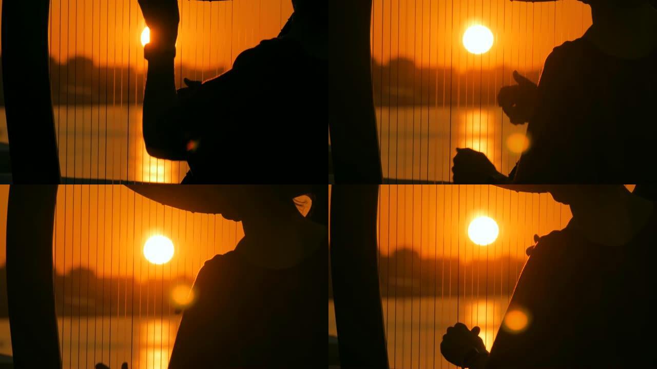 日落时弹奏竖琴的女人剪影
