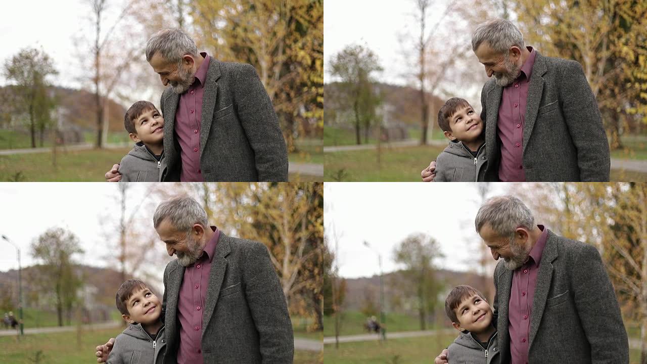 爷爷和孙子在公园里共度时光。他们在公园散步，欢欣鼓舞