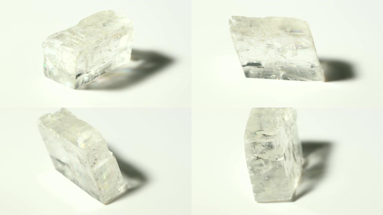 白色背景旋转的方解石矿物石样品