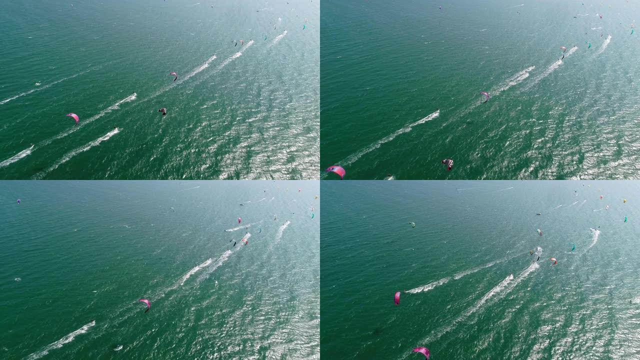 风筝冲浪帆船赛在海岸线上的鸟瞰图，绿松石水，比赛，水上运动，事件，赛车，极限运动，冒险，旅行目的地，