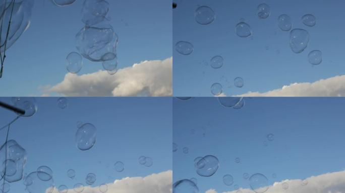 泡泡泡泡漂浮的肥皂在蓝天下飘着云