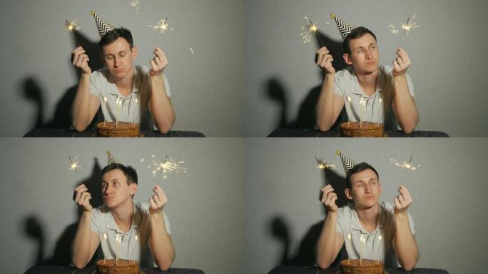 戴着派对帽的悲伤孤独的人独自庆祝生日并拿着烟火