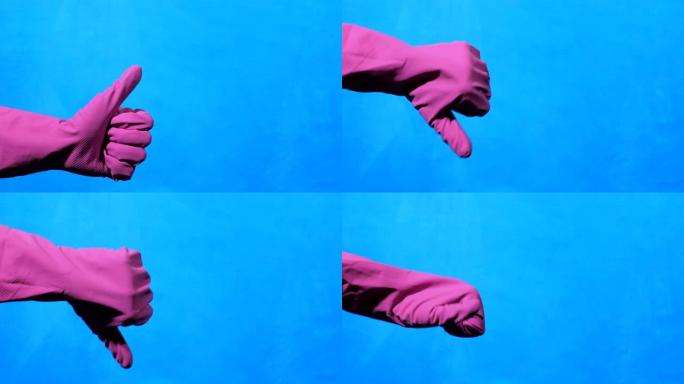 蓝色背景上紫色橡胶手套的手更干净。喜欢和不喜欢的手势。