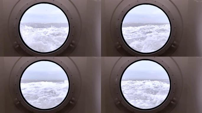 透过波涛汹涌的大海上的舷窗，海浪冲击着船