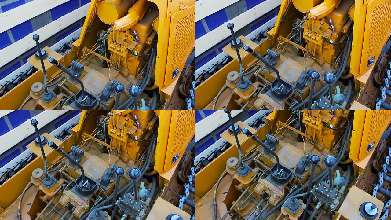 黄色推土机，带连接橡胶和软管