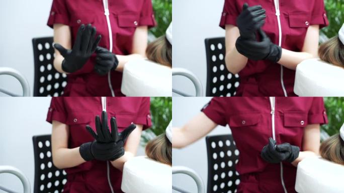 手术前戴着黑色医用手套的妇女的手