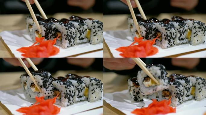 用筷子在日本餐馆里拿寿司