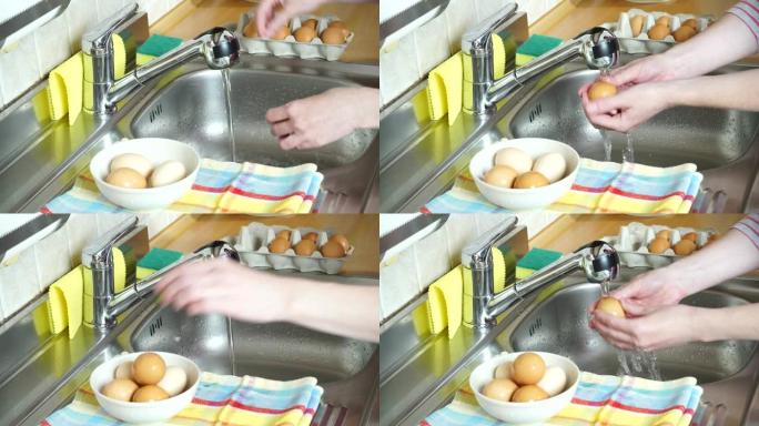 女人手在水流下的厨房里洗鸡蛋4K