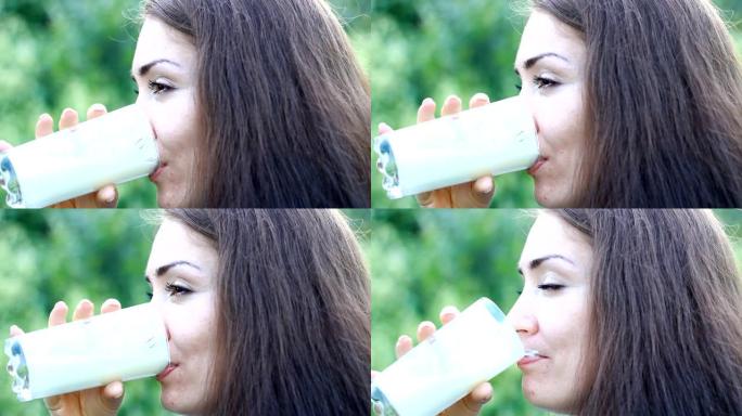 年轻女子喝牛奶饮料-牛奶，开菲尔，酸奶。