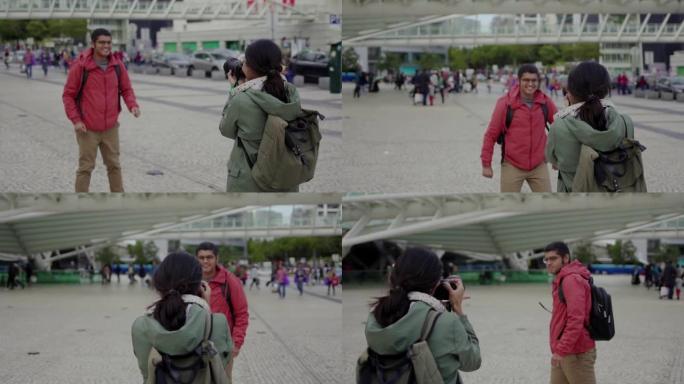 快乐的年轻人在户外拍照时跳着眼镜。