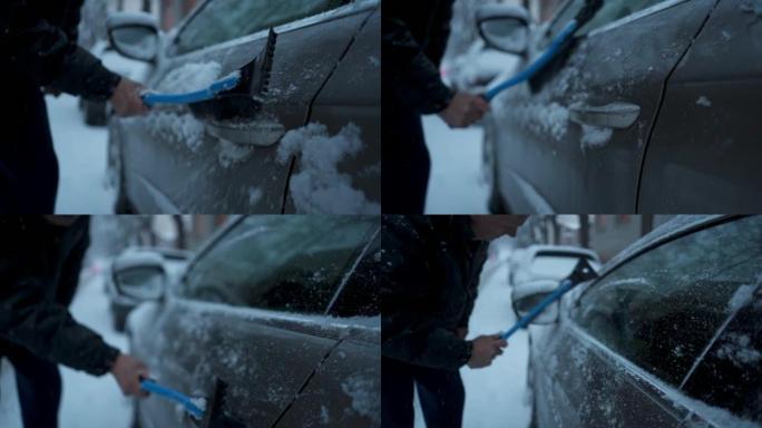 高级男子从车上除霜和雪