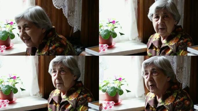 一位白发苍苍的老妇人正在说话。