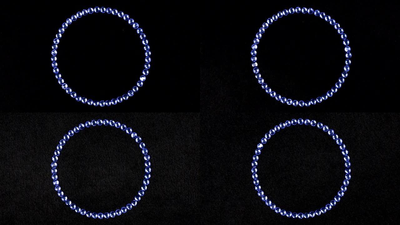 旋转由蓝色水钻制成的圆圈，无限的象征。顶视图。