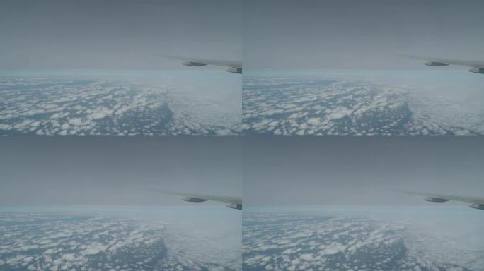 飞机窗口的空中云景变化。
