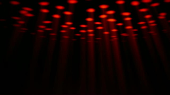 抽象移动的红色聚光灯。黑色背景。