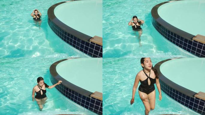 无忧无虑的女人放松游泳池暑假概念