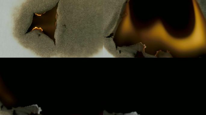 在黑色背景上通过中心燃烧纸张