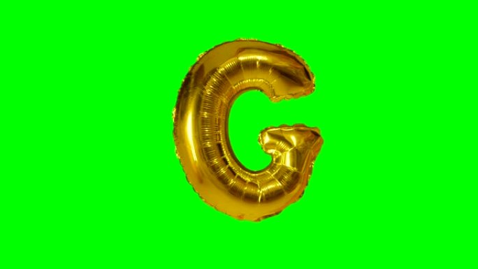 大字母G来自漂浮在绿色屏幕上的字母氦气黄金气球