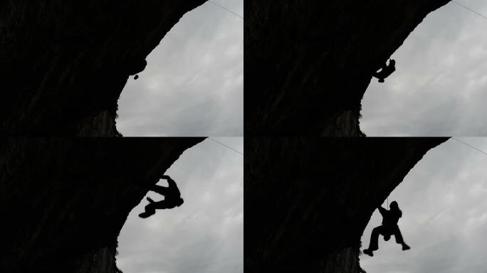 悬垂路线背光的攀岩者坠落