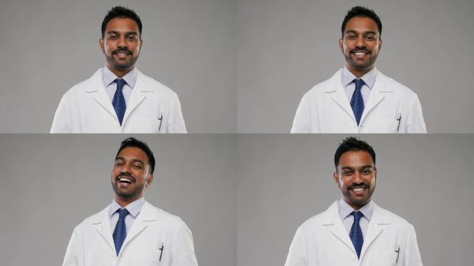 穿着白大褂的微笑男医生或科学家
