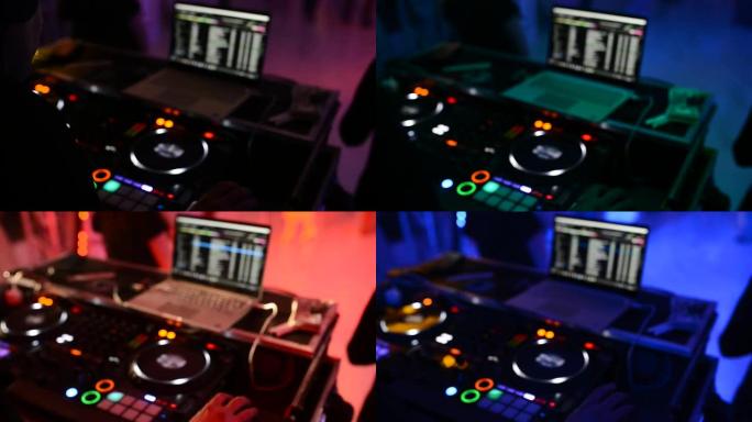 迪斯科舞厅的DJ在遥控器后面工作。舞池和轻音乐。