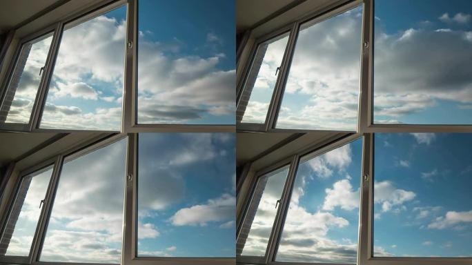 透过大型家用窗户可以看到云。