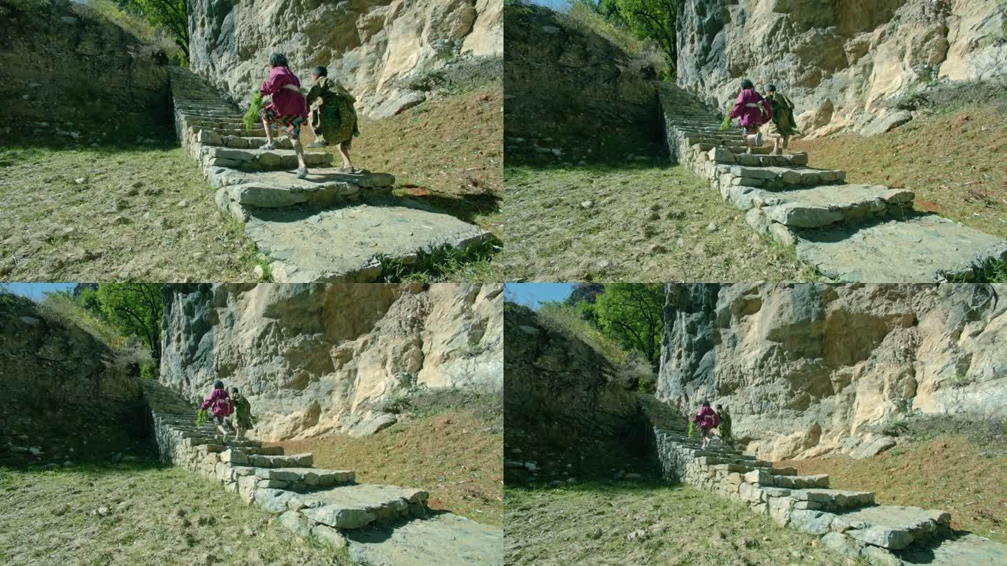 藏族男孩女孩牵手奔跑上台阶