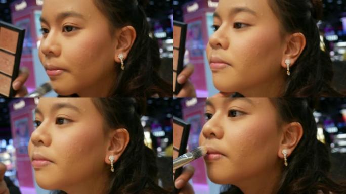 化妆师让年轻女人脸庞