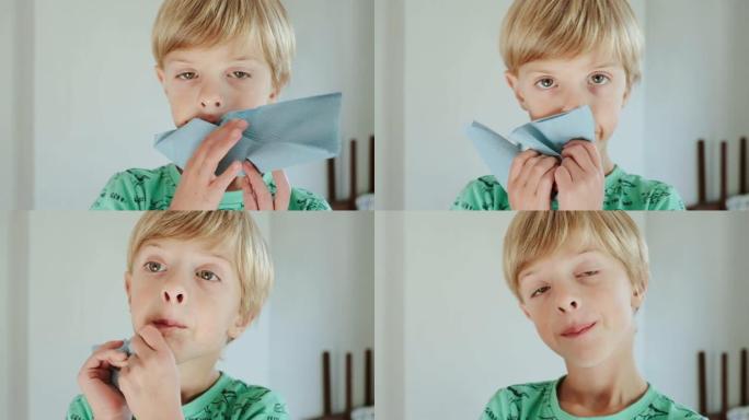 用纸巾擦脸。小男孩。特写。