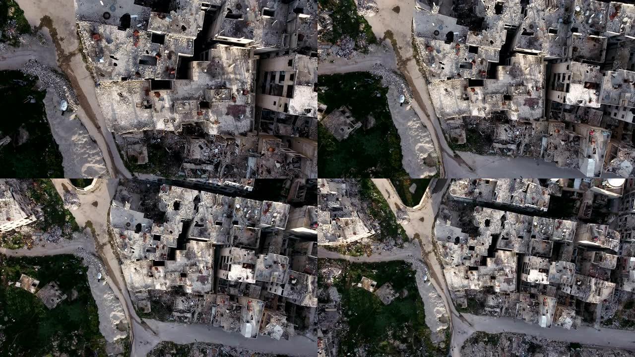 阿勒颇受损房屋的鸟瞰图。一座被轰炸摧毁的城市，只剩下残破的房屋，在蓝天下。