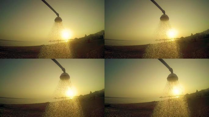 日落时分，海滩淋浴水在海中流下，慢动作